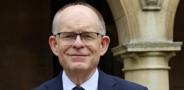 man in glasses wearing a suit