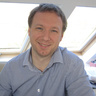 Man in shirt smiling at camera