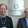 Head and shoulder image of two men in front of a sign with Camgraphic
