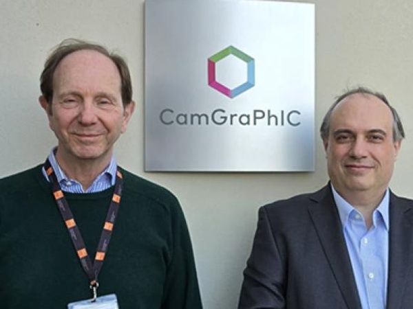 Head and shoulder image of two men in front of a sign with Camgraphic