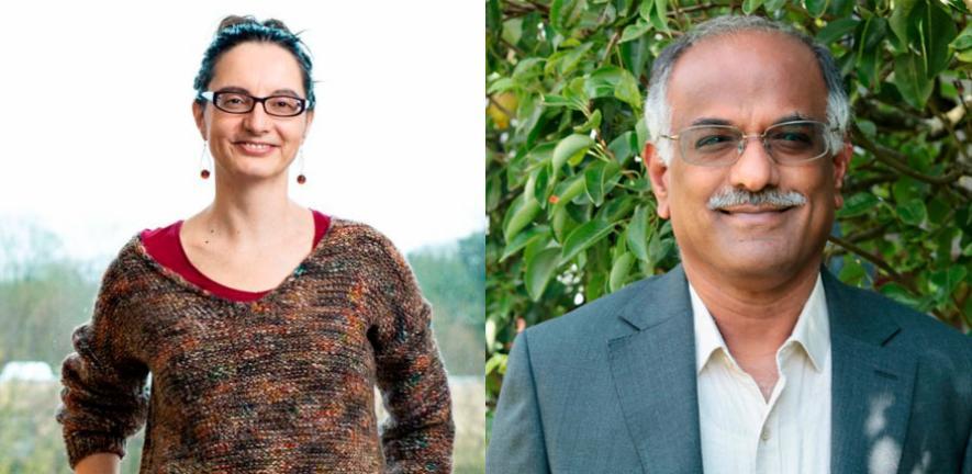 Image of head and shoulders of a man and woman both smiling and wearing glasses